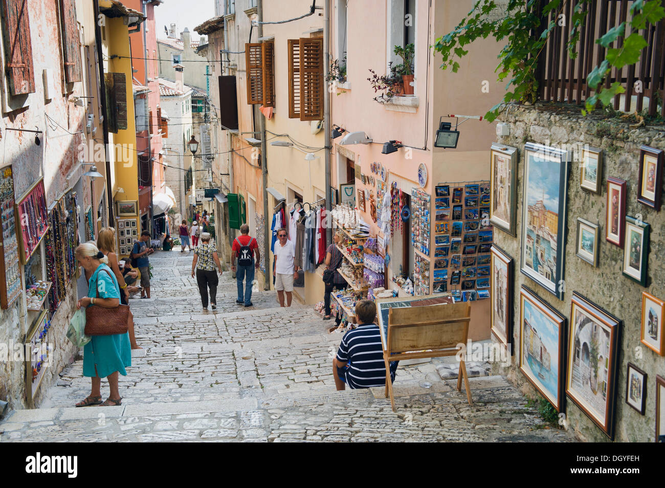 Tourists in an alley in the historic town centre with souvenir items, Rovinj, Istria, Croatia, Europe Stock Photo