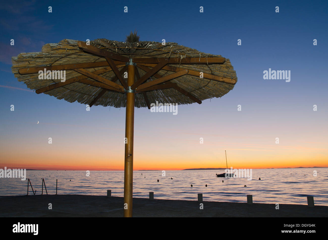 Sunshade at sunset by the seaside, Novalja, Pag Island, Adriatic Sea, Gulf of Kvarner, Croatia, Europe Stock Photo