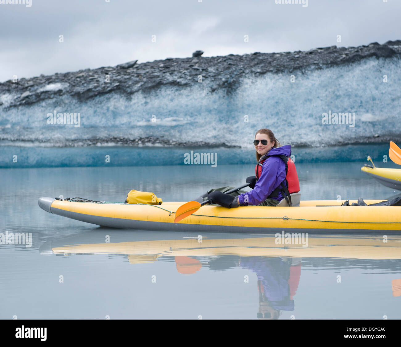 Woman kayaking at Valdez Glacier, Alaska, USA Stock Photo