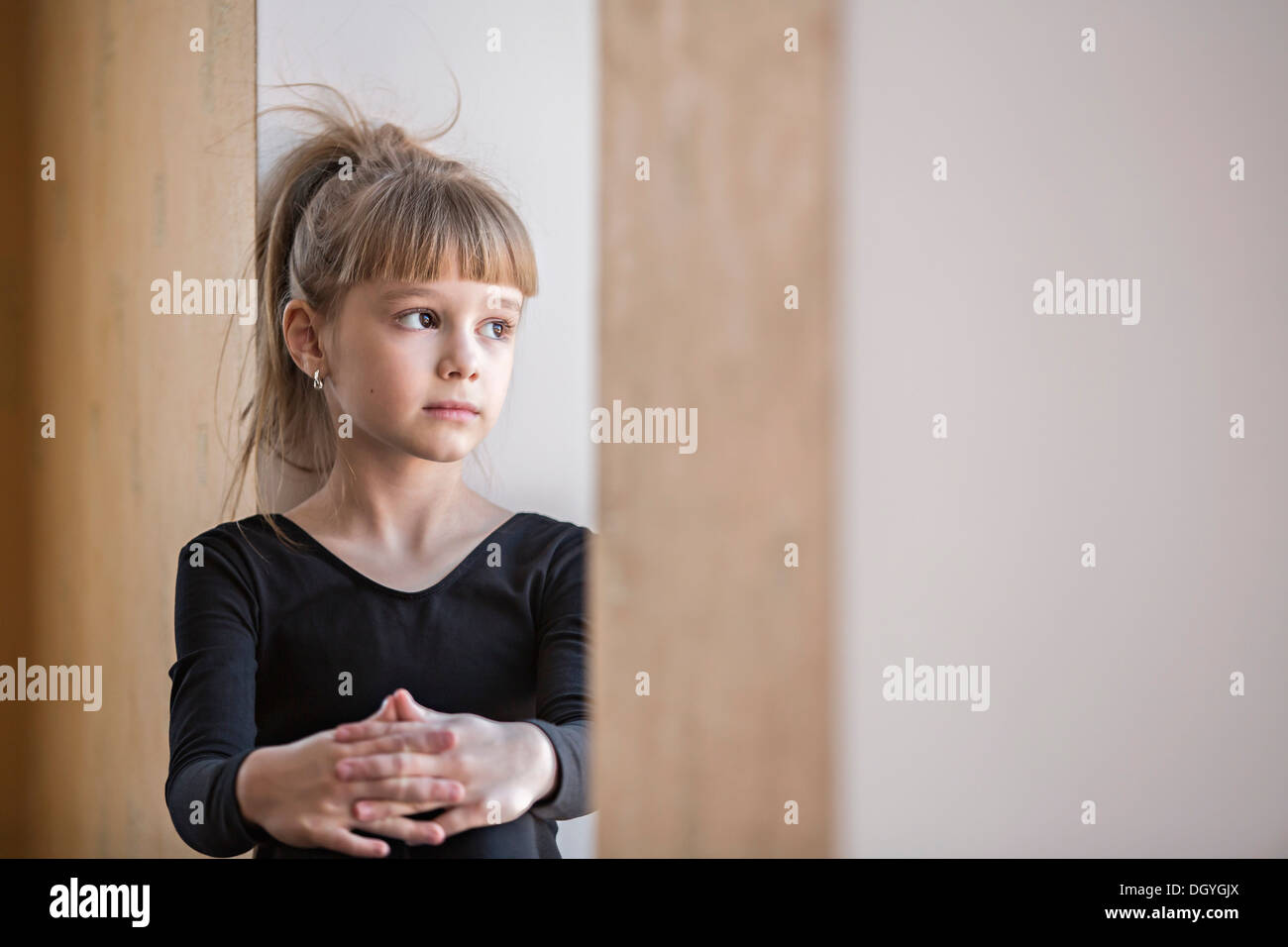 A young girl looking contemplative Stock Photo
