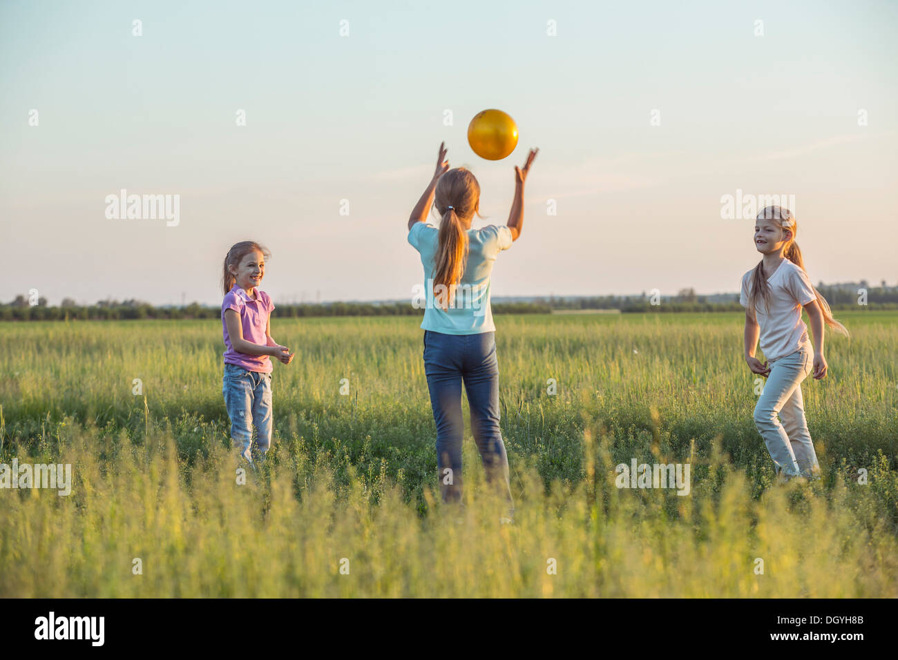 Three girls standing hi-res stock photography and images - Alamy