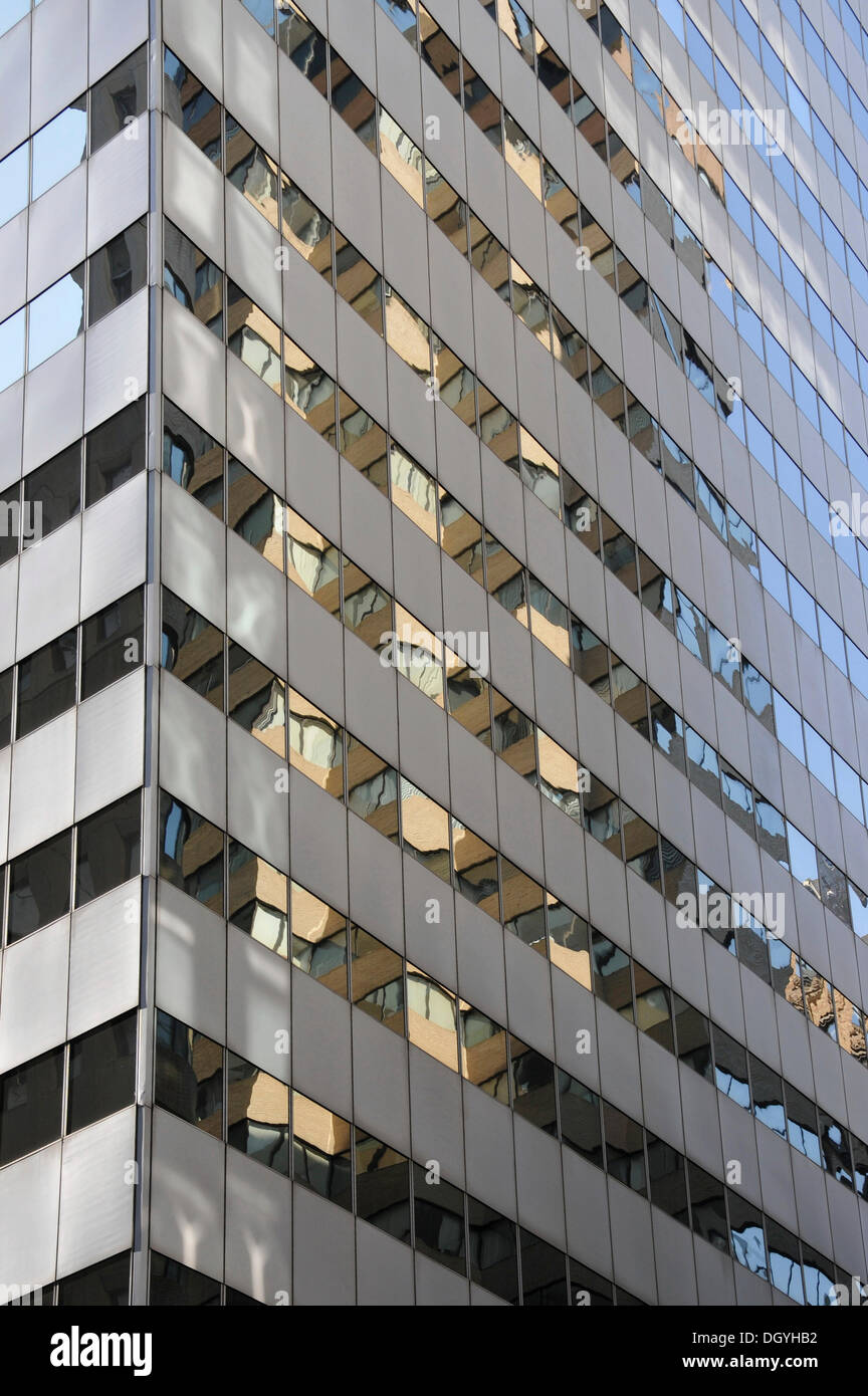 Reflections on a glass-fronted high-rise building, New Street, Financial District, New York City, New York, USA Stock Photo