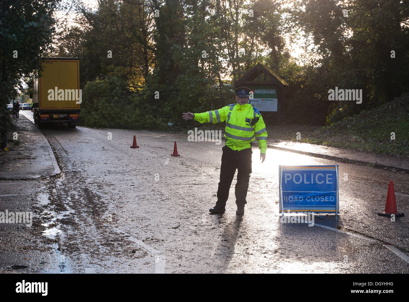 High 28th Oct, 2013. A Thames Valley Policeman diverts traffic due to a large tree