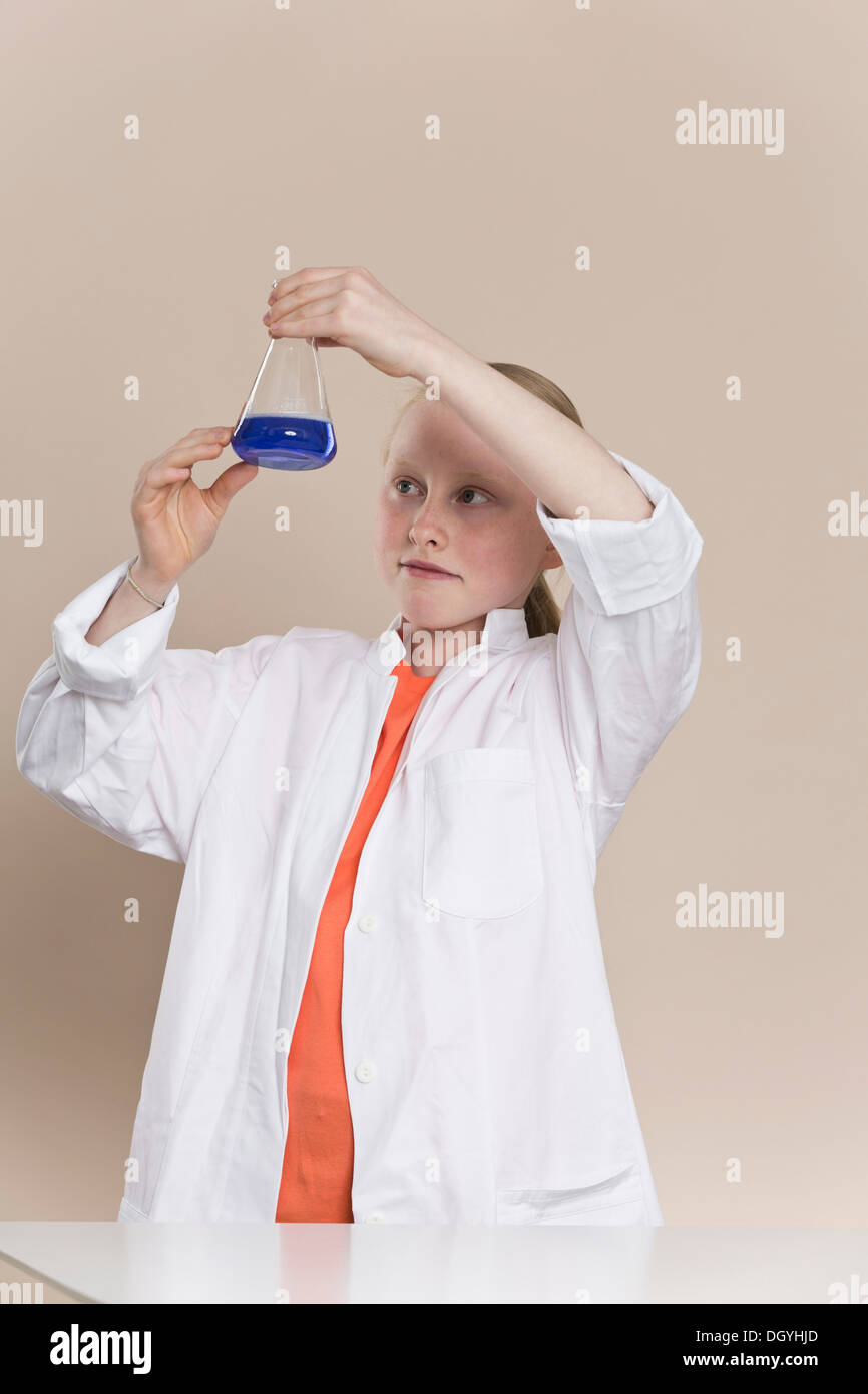 Portrait of a scientist holding liquid in a flask hi-res stock ...