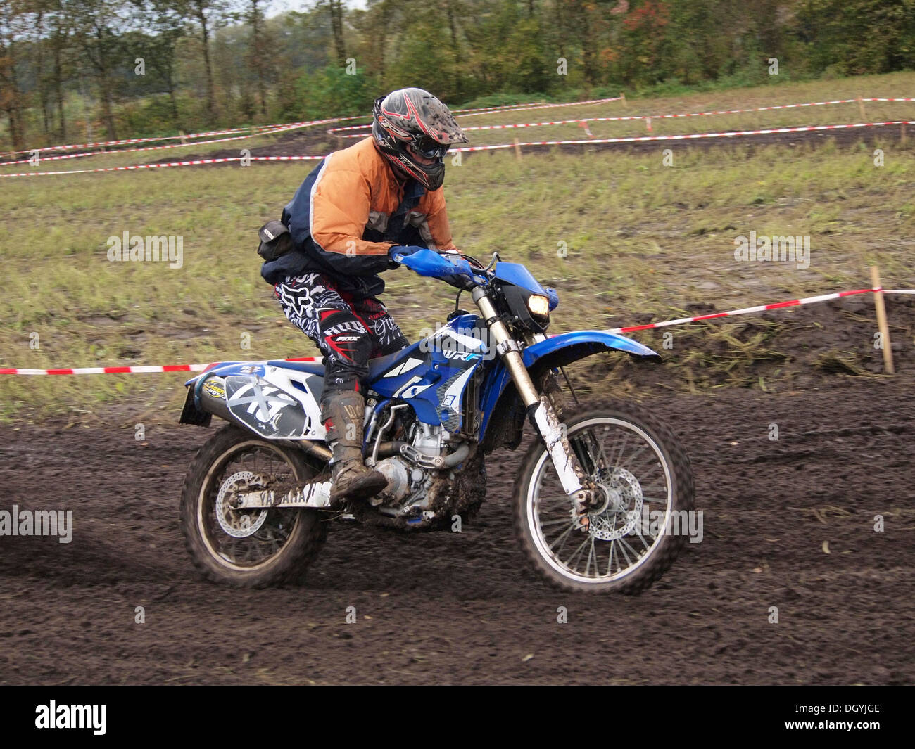 Man riding his Yamaha WRF450 motorcycle on dirt track during the yearly enduro rallye in Ruurlo, Gelderland, the Netherlands Stock Photo