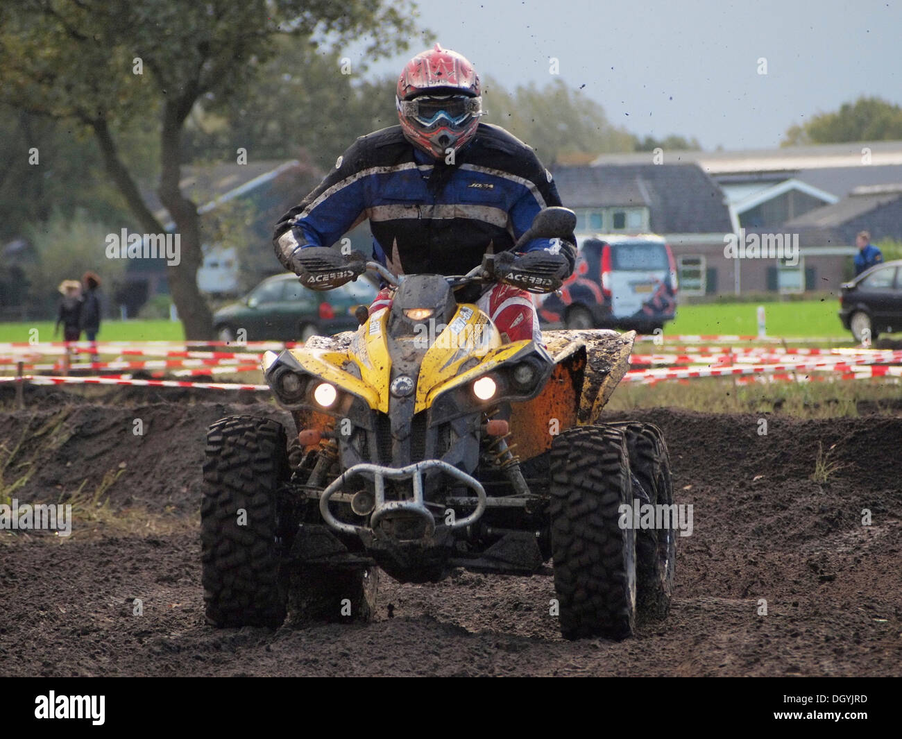 Powerful large quad riding on dirt track during the yearly enduro rallye event in Ruurlo, Gelderland, the Netherlands Stock Photo
