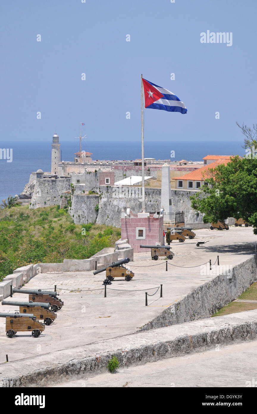 Cuba, Havana. Fortress wall and Cuban flag at San Carlos de