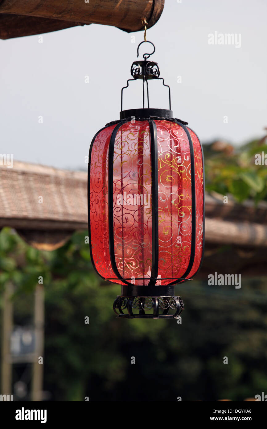It's a photo of a Chinese lantern or Asian lamp that is hanged to the  corner of a roof to fight the spirits or ghosts Stock Photo - Alamy