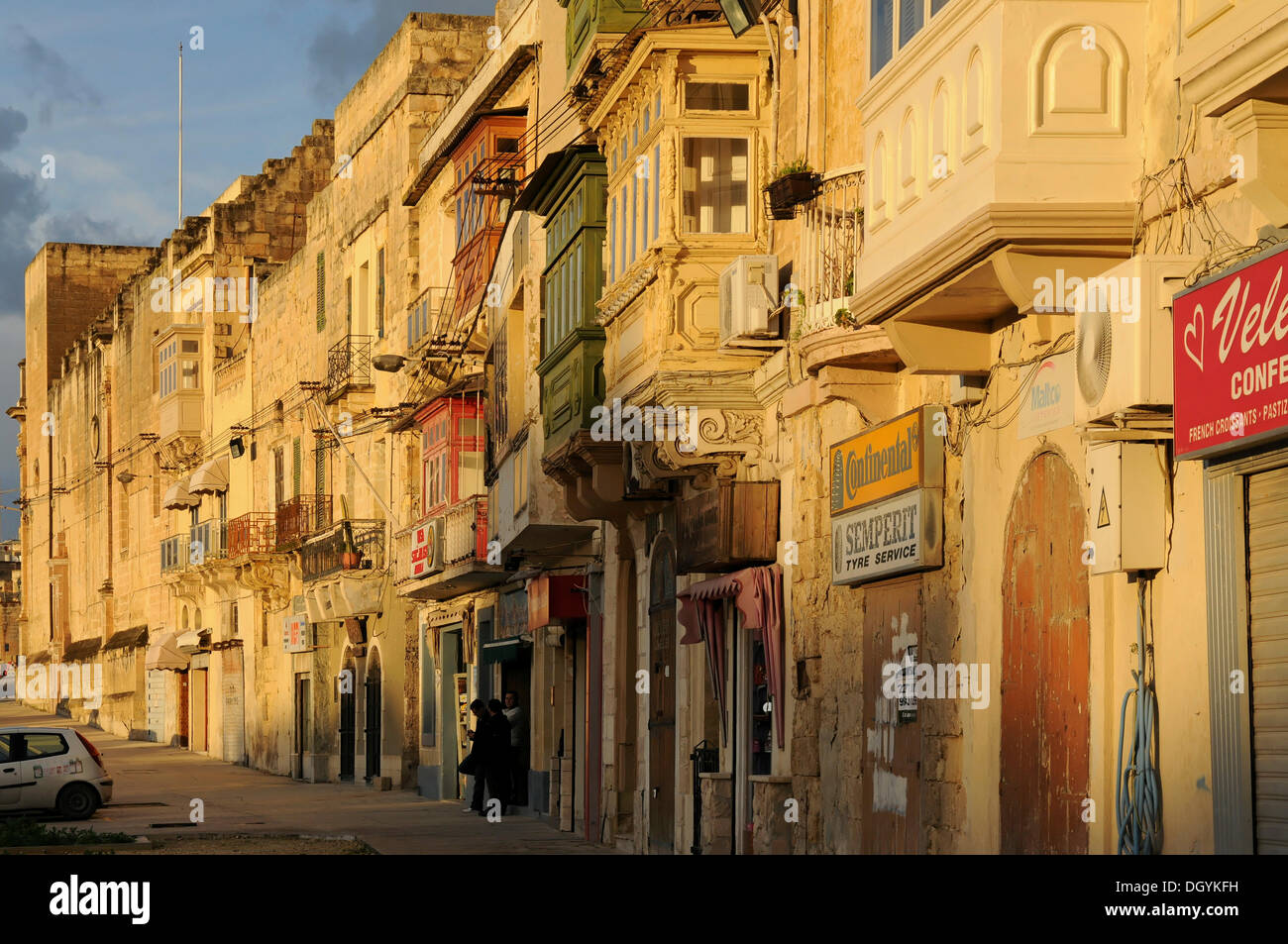 Row of houses, shops in the evening light, Bormla, Malta, Europe Stock