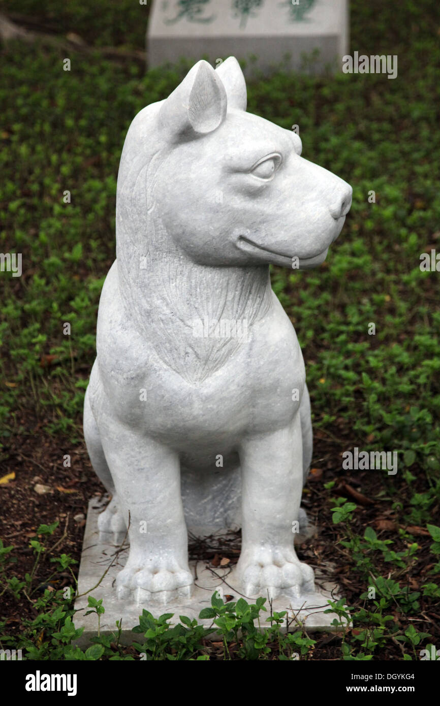 It's a photo of a statue in Paster or white material that is representing a Chinese zodiacal animal: Rabbit Dragon Ox dog cow Stock Photo