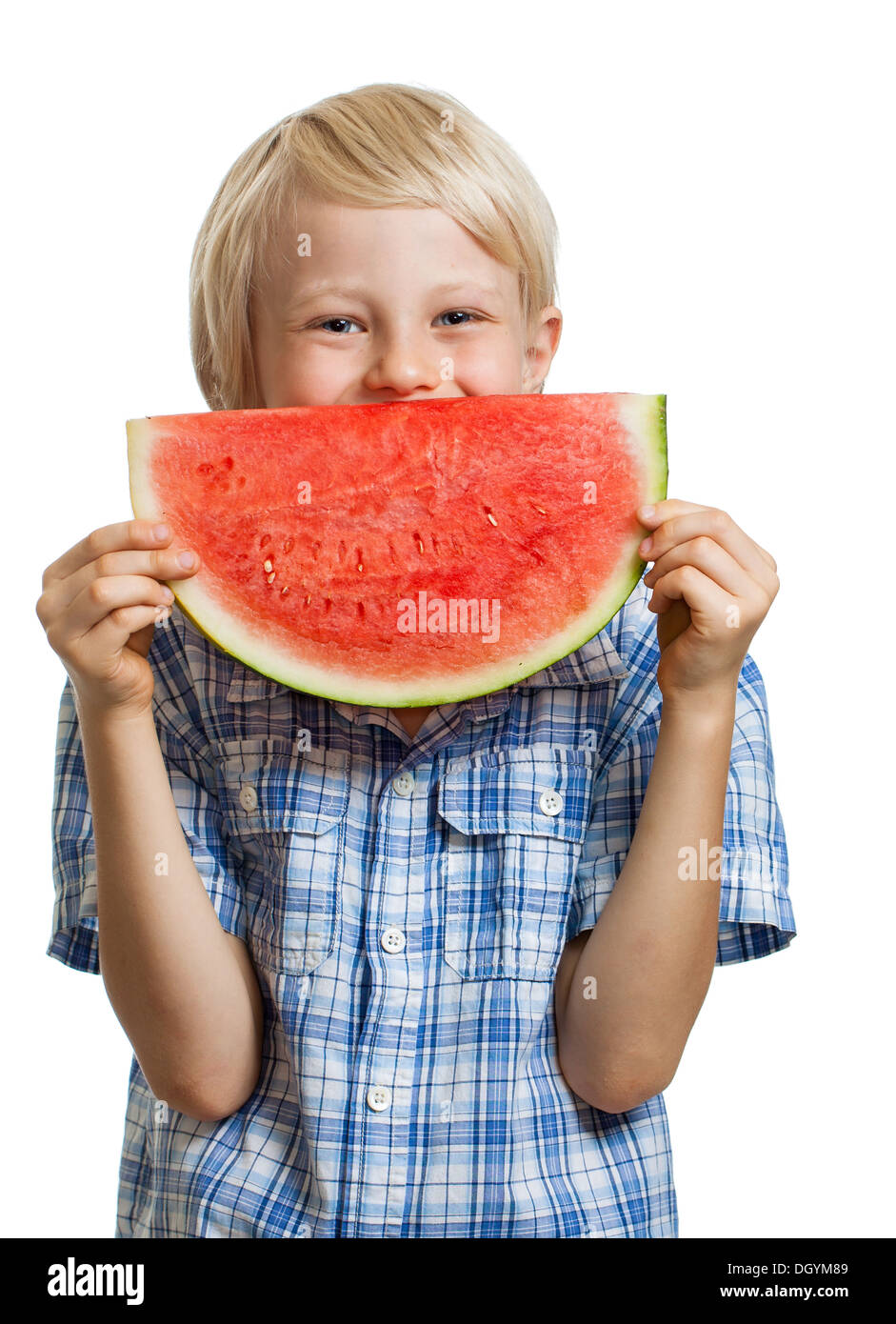 A cute happy boy peeking behind a juicy slice of watermelon. Isolated on white. Stock Photo