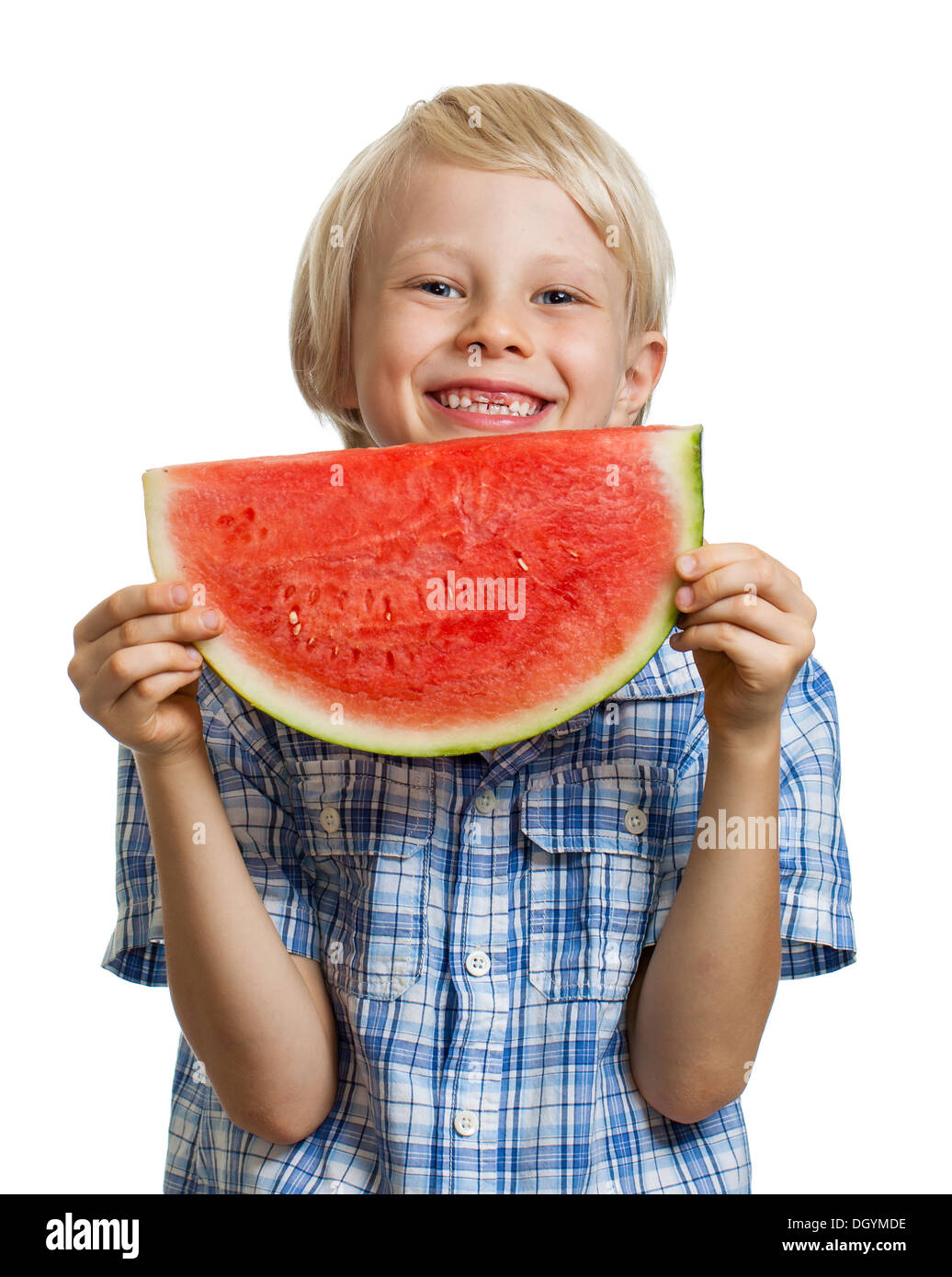 A laughing cute boy holding a juicy slice of watermelon. Isolated on white. Stock Photo