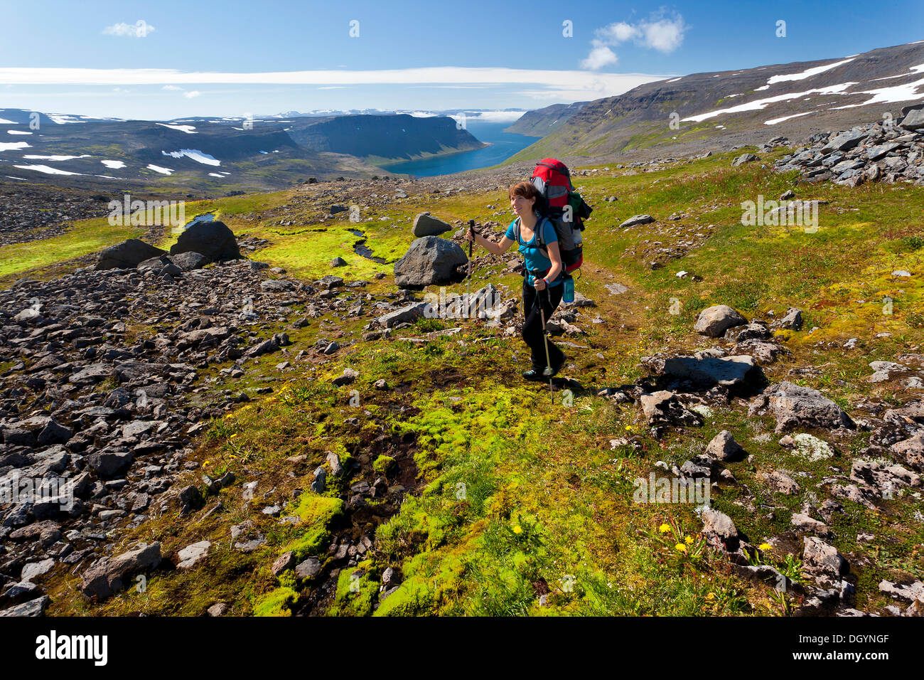 Young woman trekking, Hornstrandir, Westfjords, West Iceland, Iceland, Europe Stock Photo