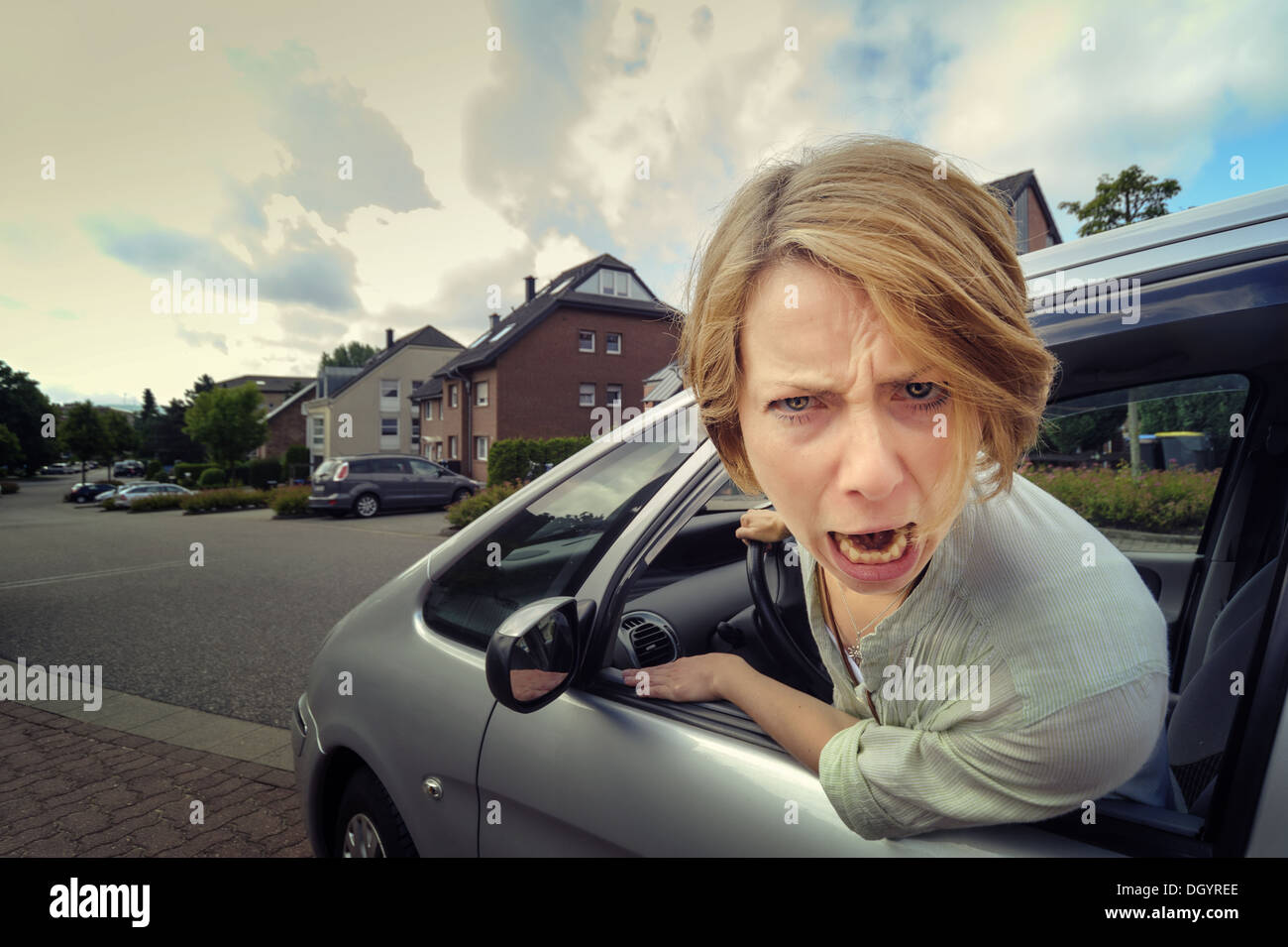 aggressive car driver yells out the window Stock Photo