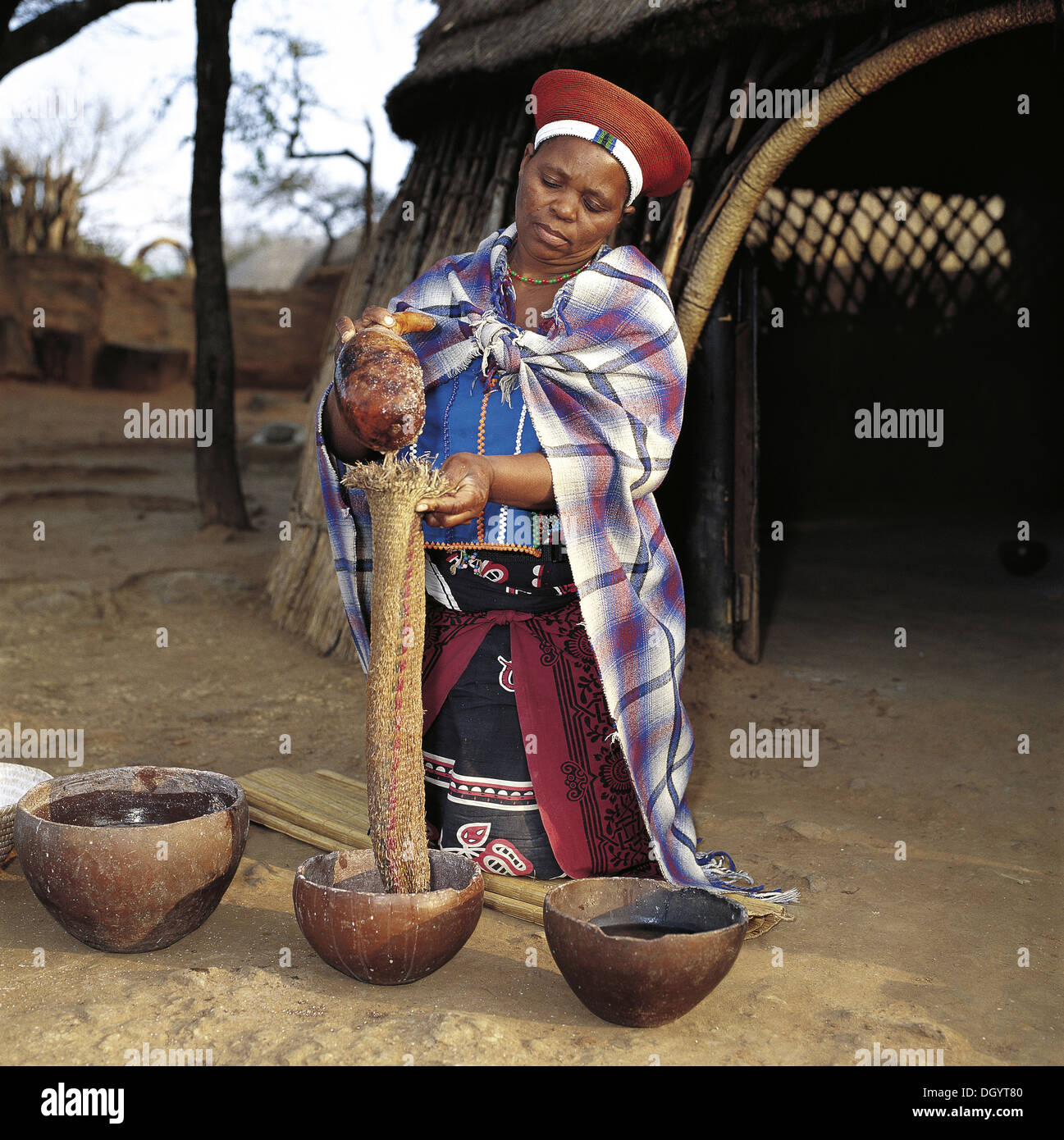 Zulu woman making beer hires stock photography and images Alamy