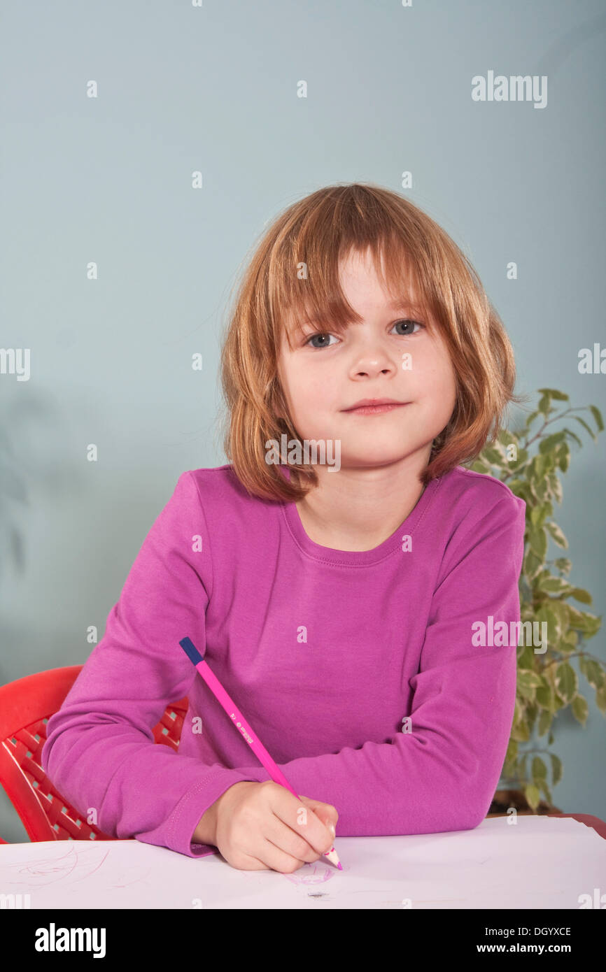 Girl, six years, painting Stock Photo
