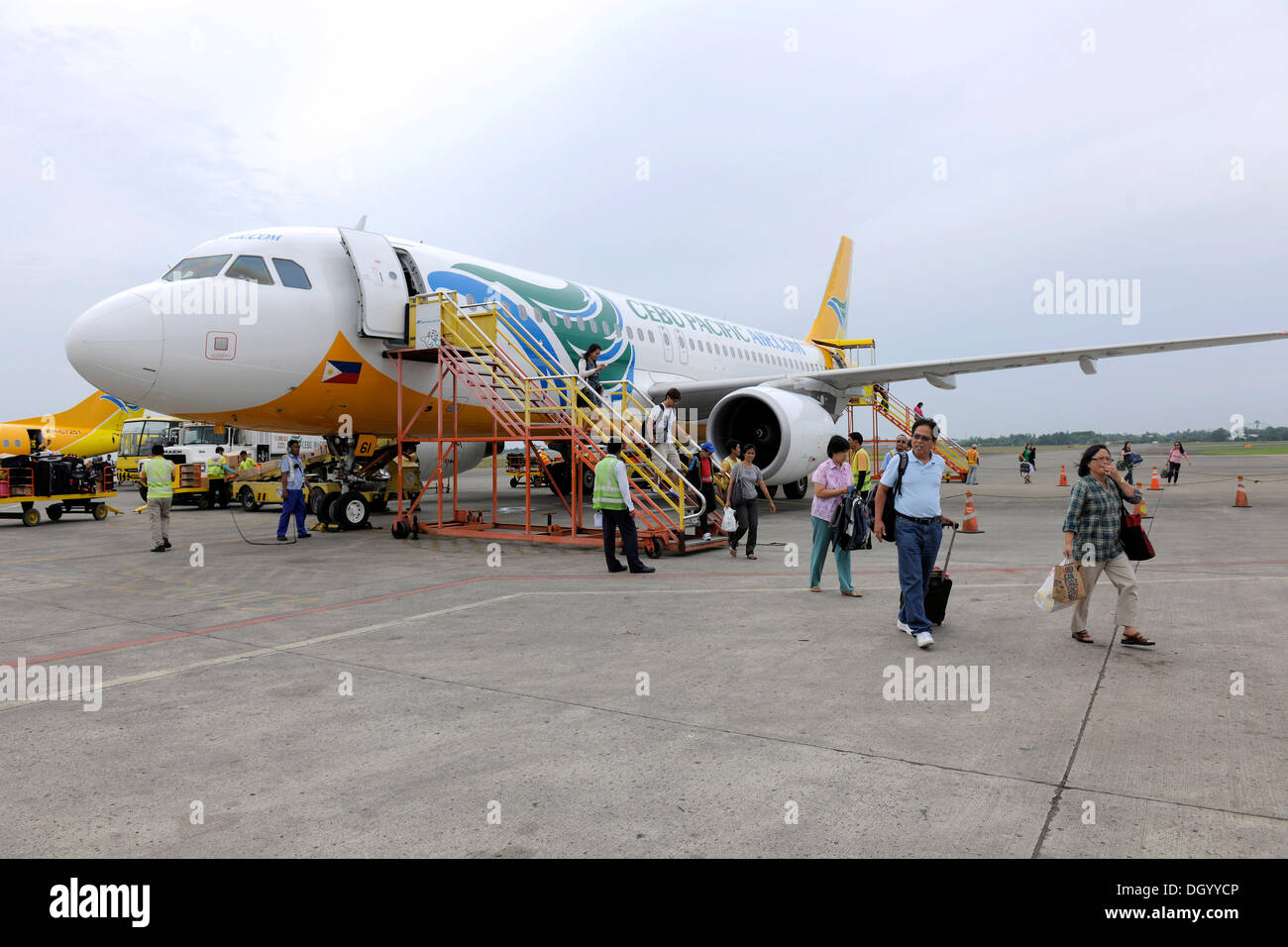 Tourists getting out of a plane from Cebu Pacific airlines, Cebu, Philippines, Southeast Asia, Asia Stock Photo