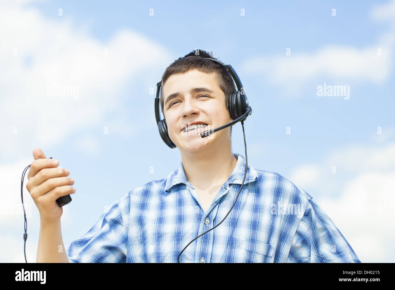 Smiling boy with headphones and Mic Stock Photo