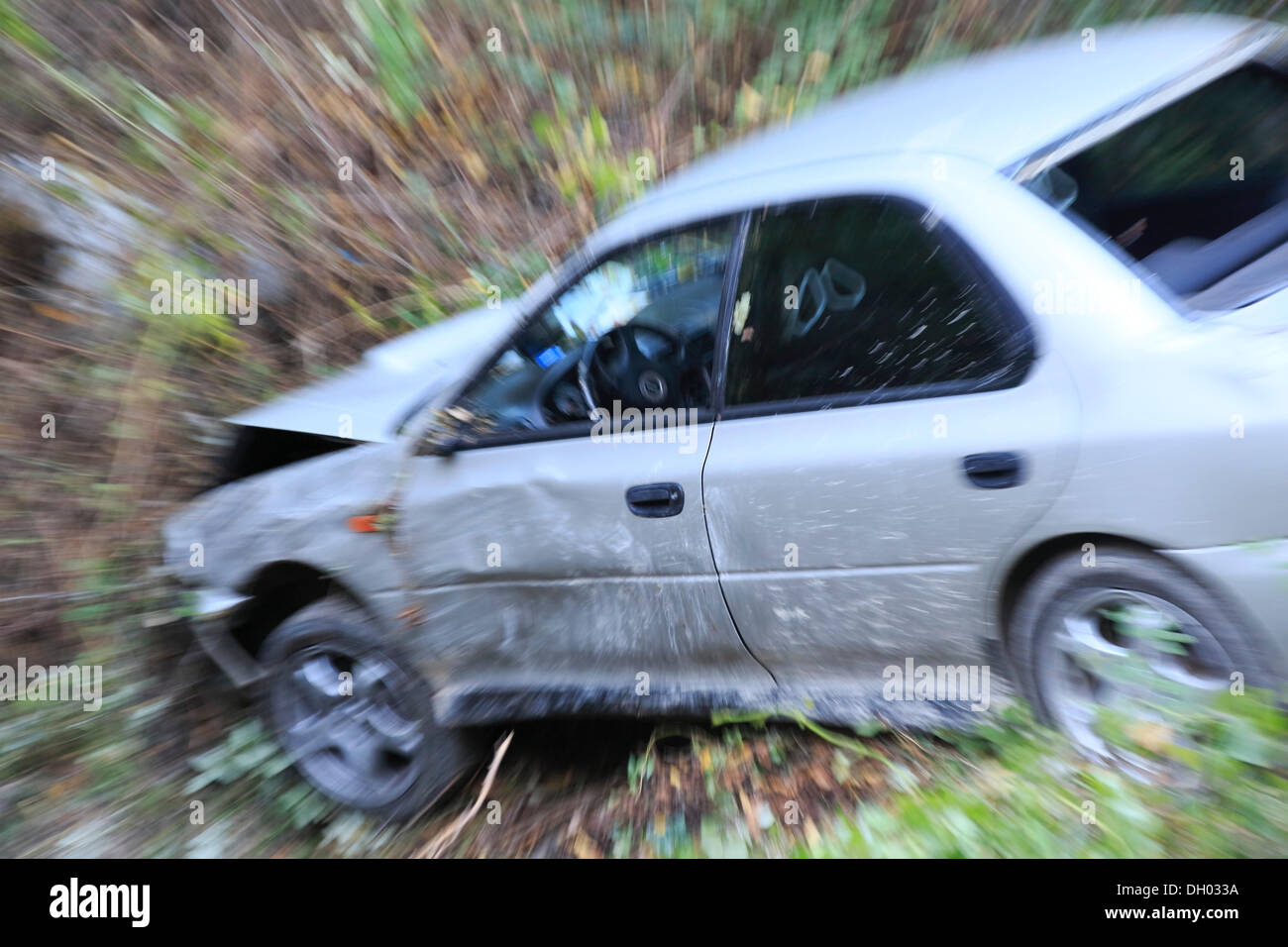 Car which has driven off the road and down an embankment, traffic accident Stock Photo