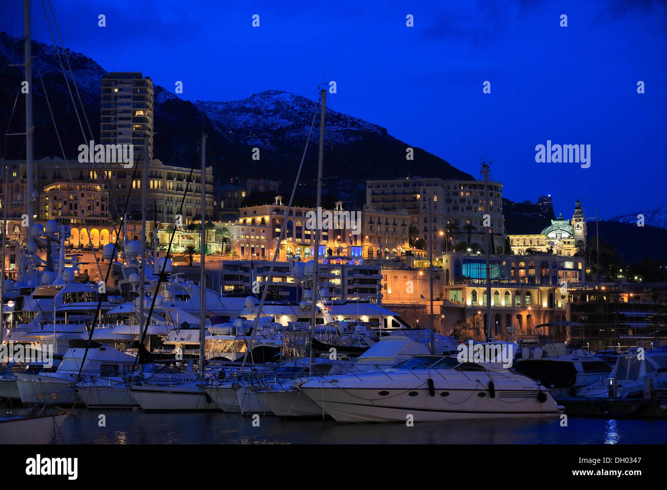 Port Hercule, Monte-Carlo, snow-capped mountains at back, in the evening, dusk, Fürstentum Monaco, Monaco Stock Photo
