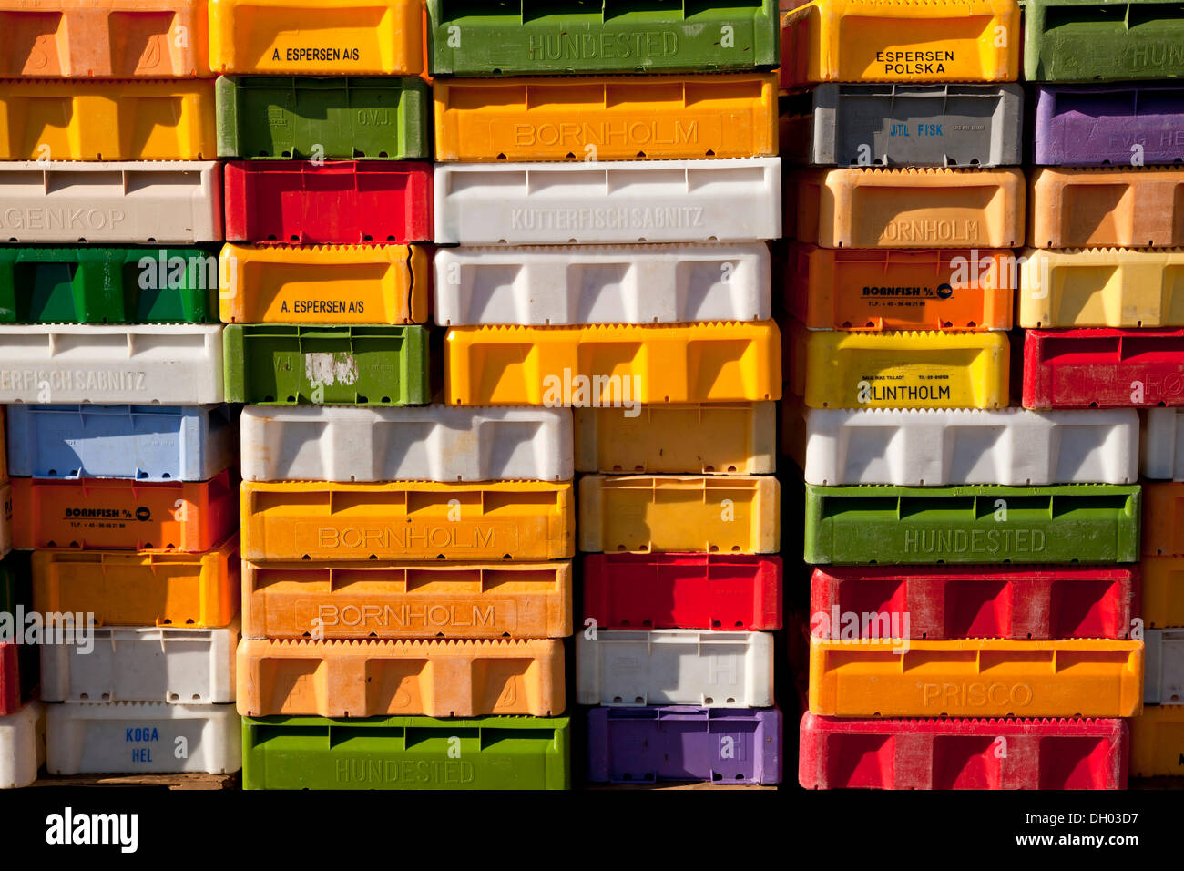 Colourful crates for fish in the port of Maasholm, Schleswig-Holstein Stock Photo