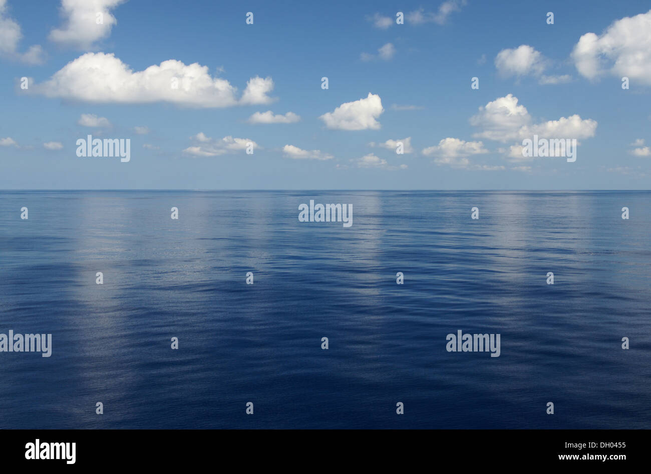 Blue sky and white clouds over the sea Stock Photo - Alamy