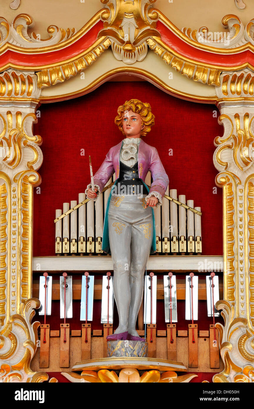 Wooden figure of a female orchestra conductor on an old Fritz Wrede carousel organ or fairground organ, historical Oktoberfest Stock Photo