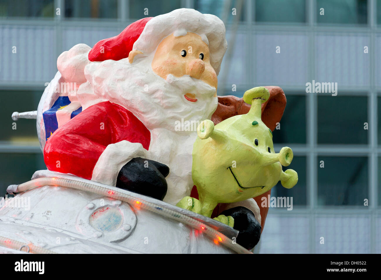 Santa Claus figure with a green alien in a flying saucer, Christmas market, Franz-Josef-Strauss-Airport, Munich, Upper Bavaria Stock Photo