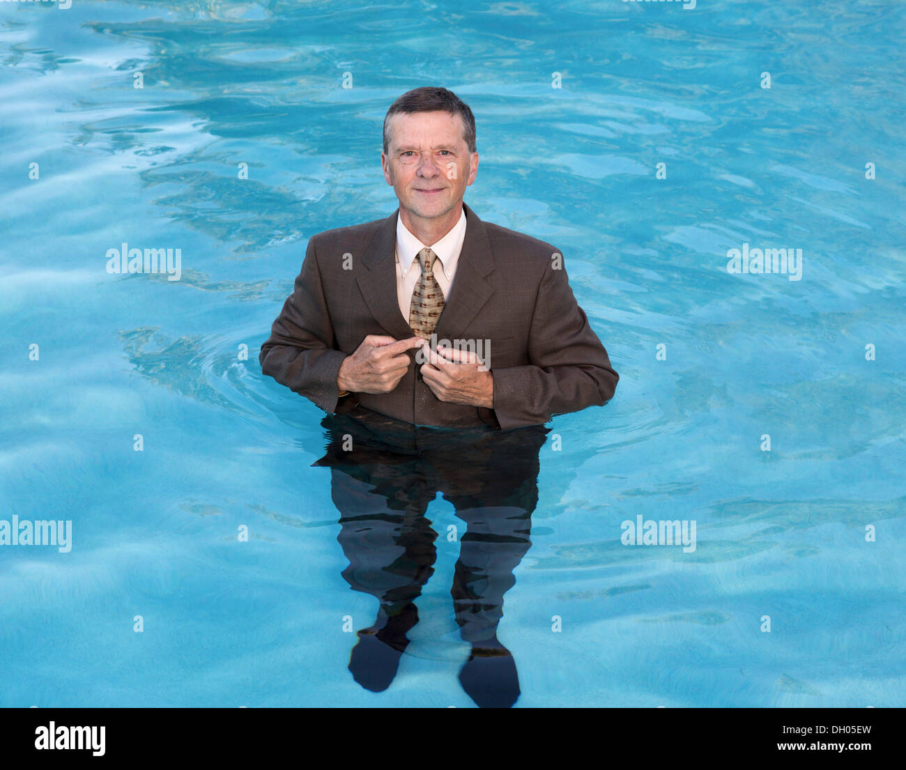 Businessman in suit up to waist in water - business, senior employment, interview concept Stock Photo