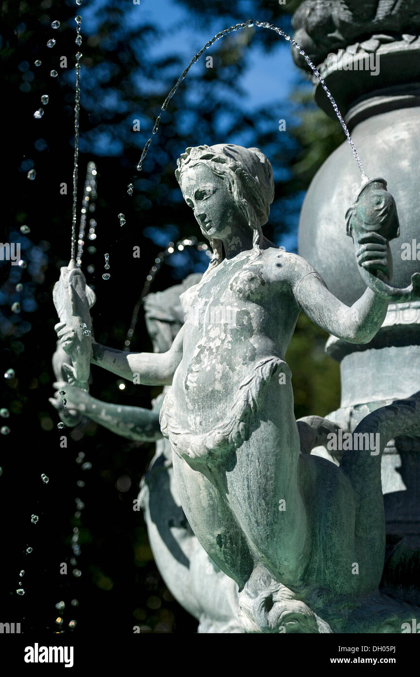 Mermaid holding fish in an Art Nouveau style fountain, Fortuna Fountain by Karl Killer, Isartorplatz, Munich, Upper Bavaria Stock Photo
