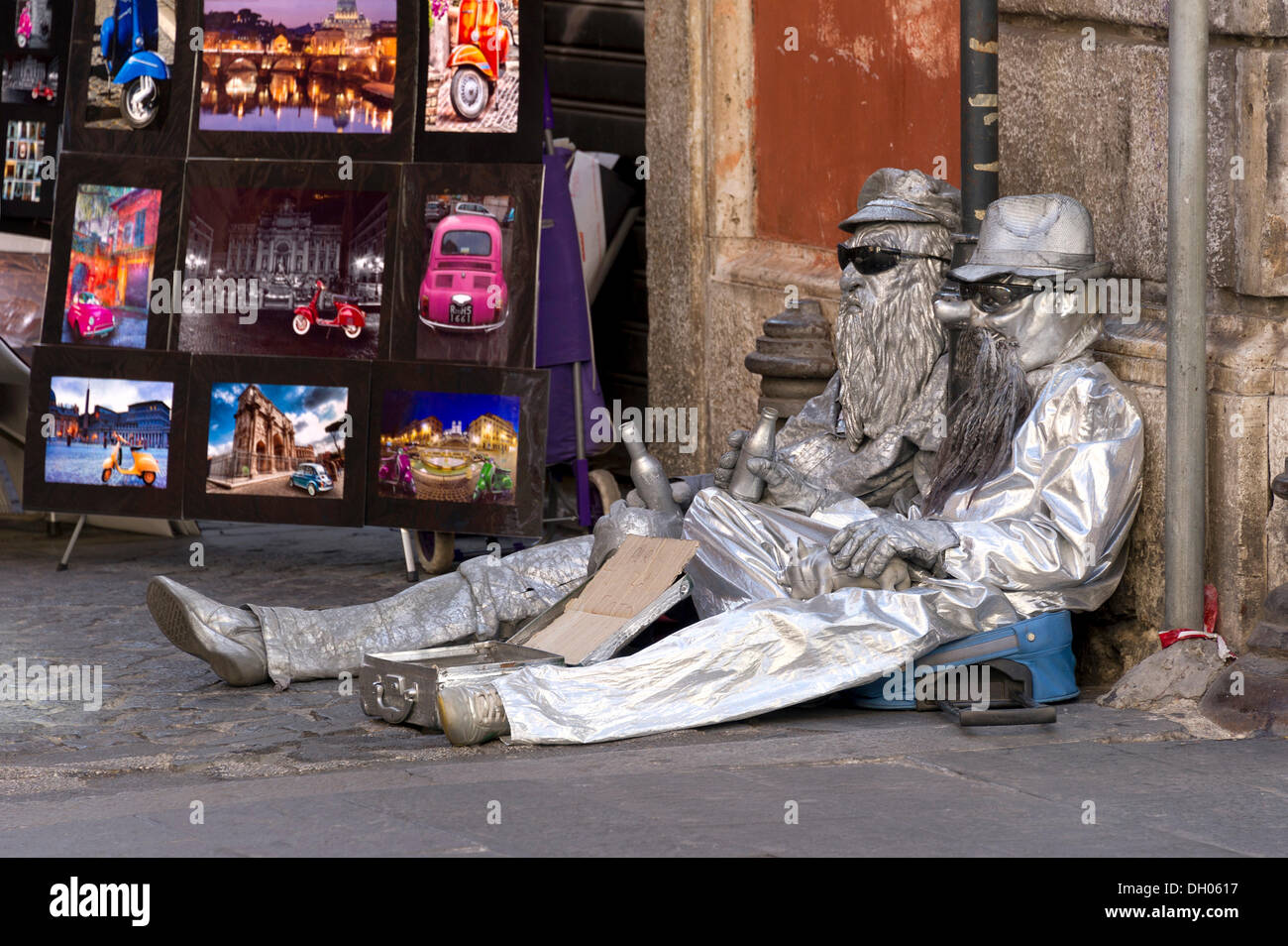 Beggars in silver-coloured costumes, Via del Corso, Rome, Lazio, Italy Stock Photo
