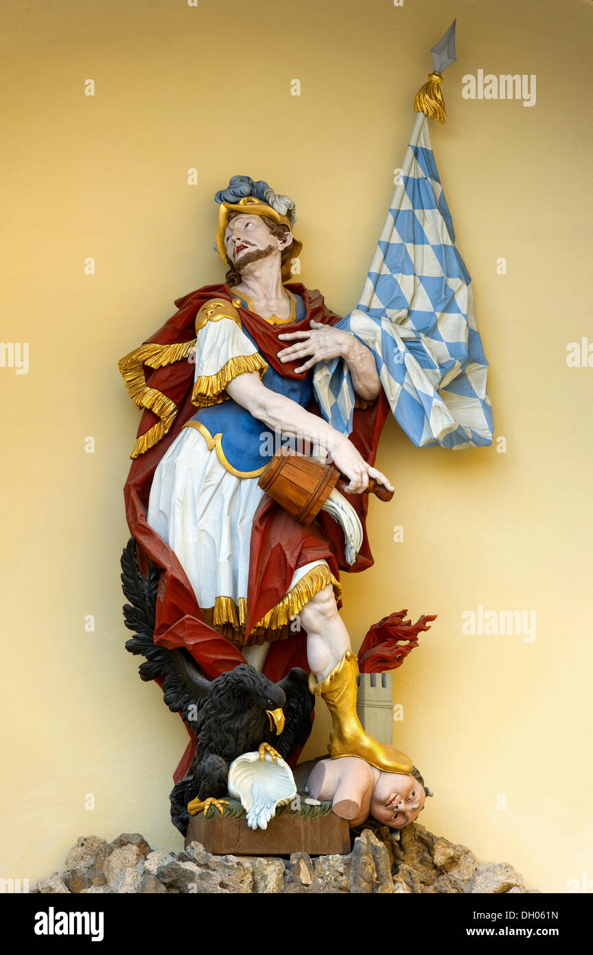 Copy of the rococo figure of St. Florian made of lime wood by Christian Jorhan the Elder, 1762 AD, on the Florian Fountain Stock Photo