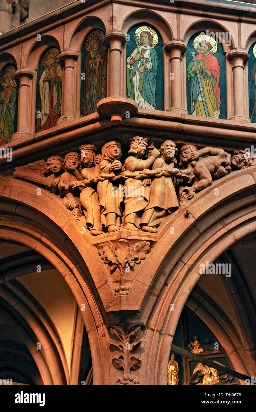 Relief of 'damned' on the rood screen, Romanesque Church of St. Mary, Gelnhausen, Hesse, Germany Stock Photo