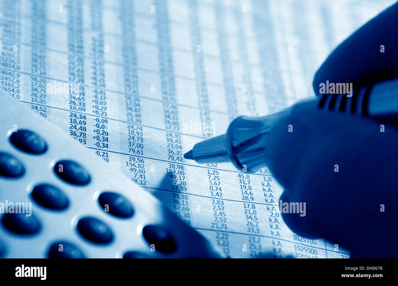Pen marking stock prices, financial markets, stock exchange Stock Photo