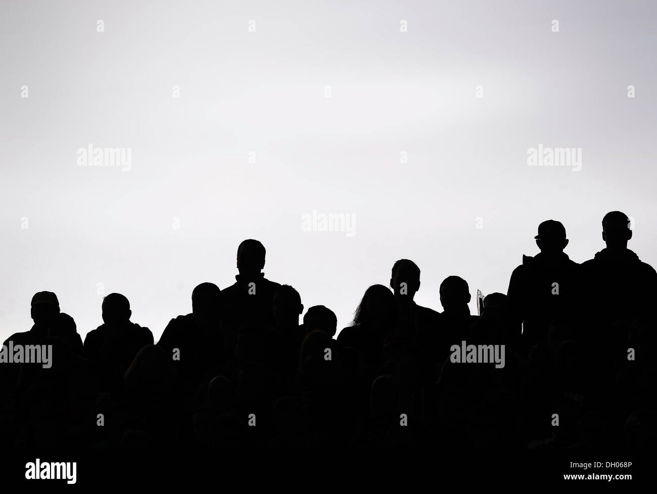 Spectators at a football match, silhouettes, Oberstenfeld, Baden-Württemberg, Germany Stock Photo