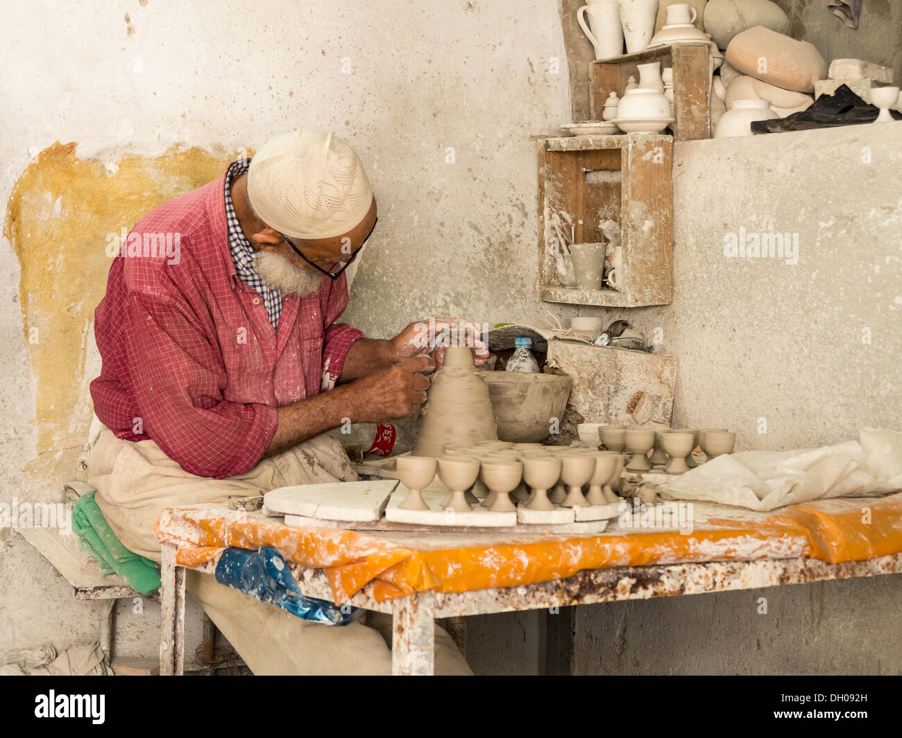 Artisan potter in small pottery in Morocco making egg cups Stock Photo