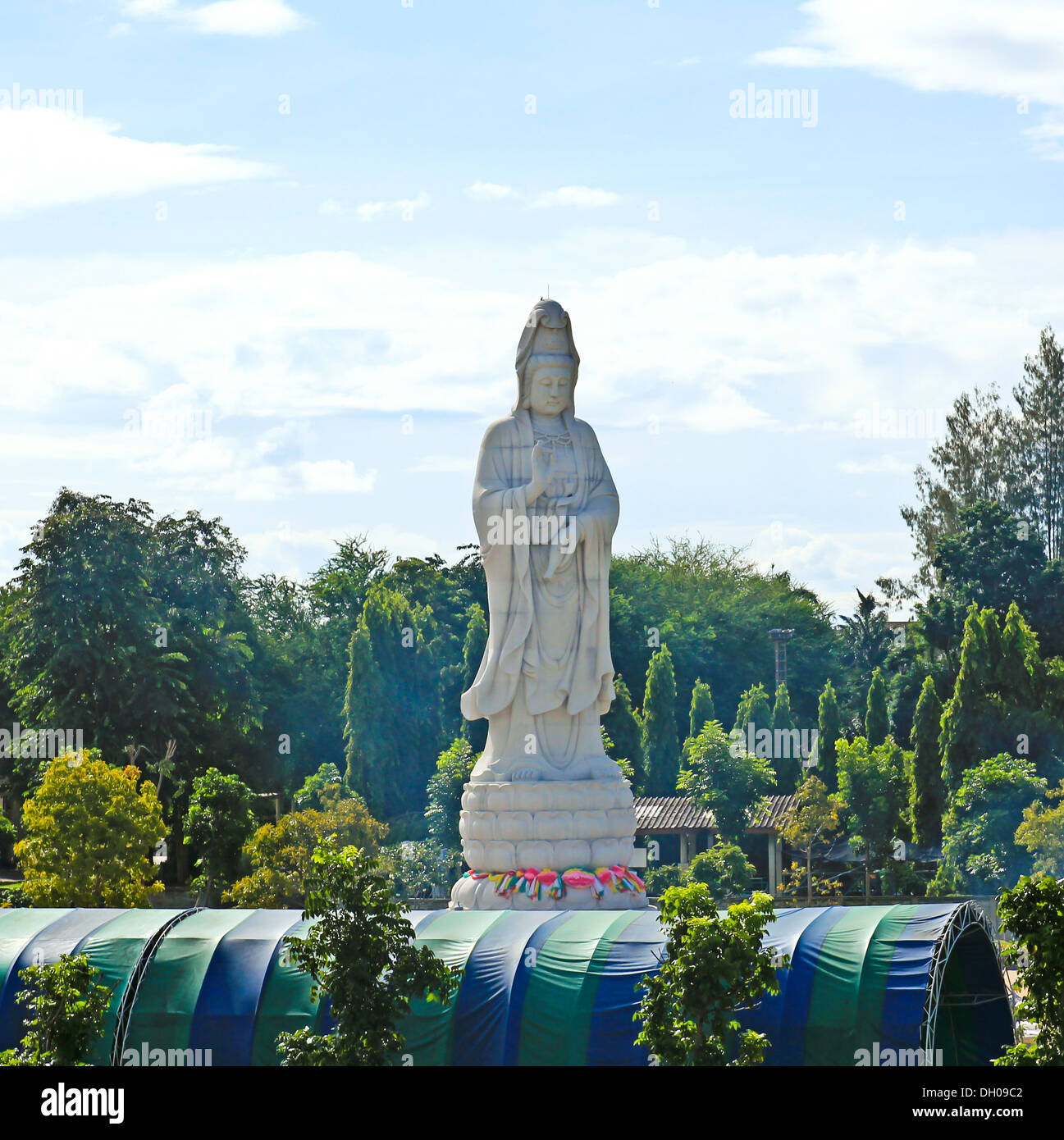 White marble statue of Buddha in the river Kwai valley Stock Photo