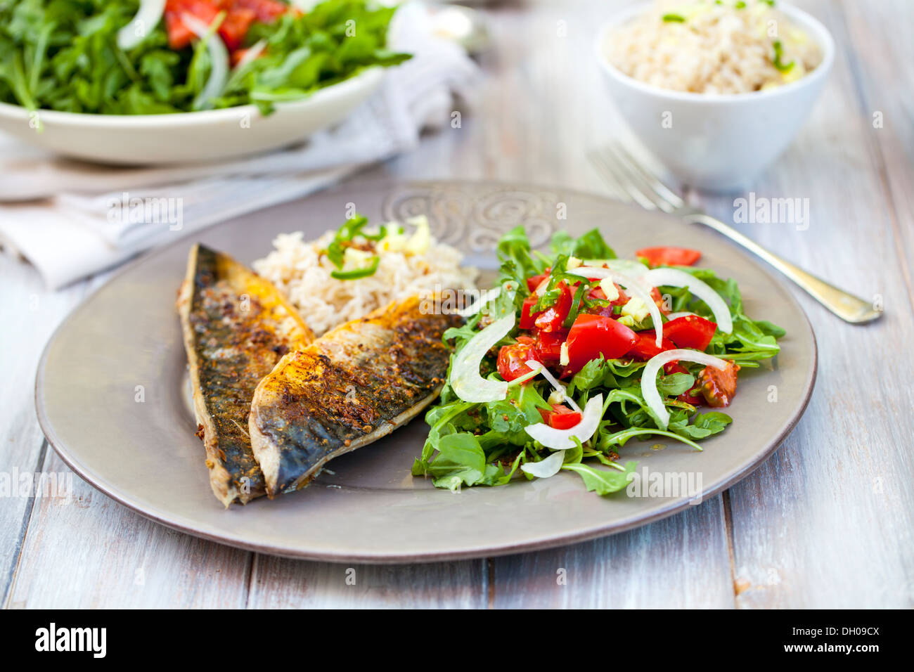 Mackerel fillets with salad and rice Stock Photo Alamy