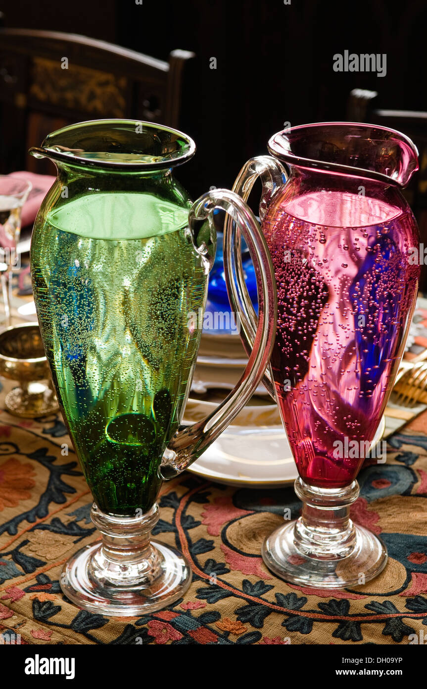 Two coloured glass water jugs Stock Photo