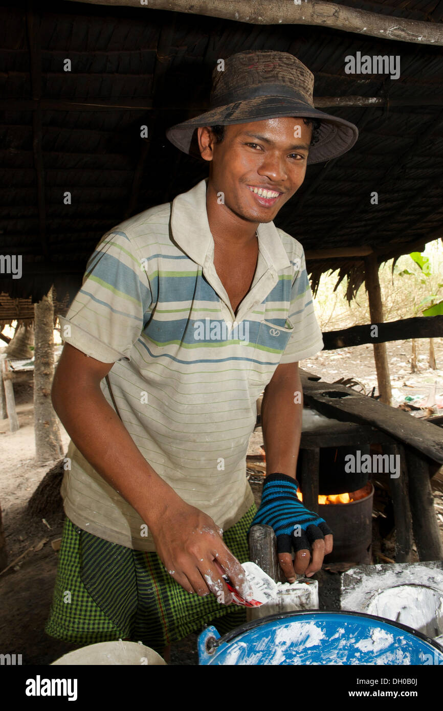 Young man during the production of fresh rice noodles, Siem Reap, Siem Reap Province, Cambodia Stock Photo