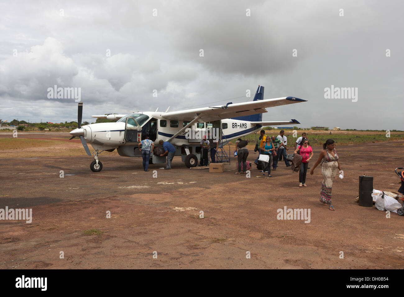 Passengers disembark from a small aircraft at Letham airport, Guyana, South America Stock Photo