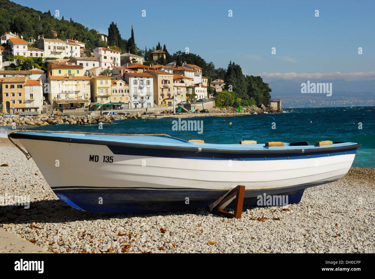 Fishing port in the Kvarner Gulf with a fishing boat on a pebble beach on the Croatian Adriatic coast, Moscenicka Draga Stock Photo