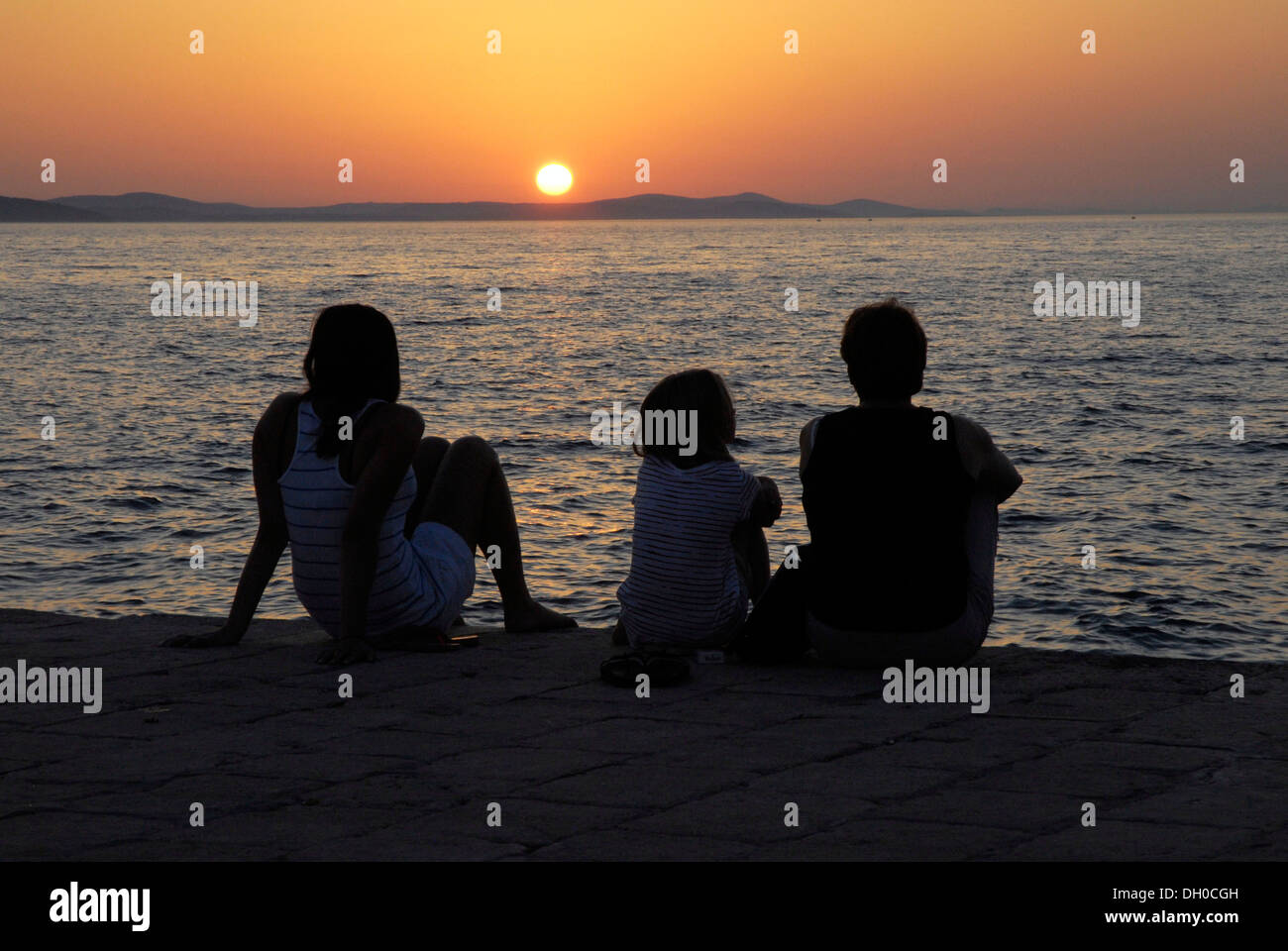 People watching the sunset from a port mole, Zadar, Dalmatia, Adriatic, Croatia, Europe Stock Photo
