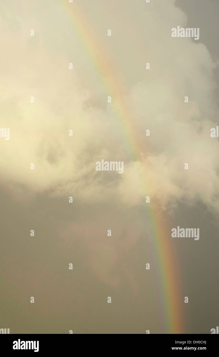White cold air cloud with a rainbow Stock Photo