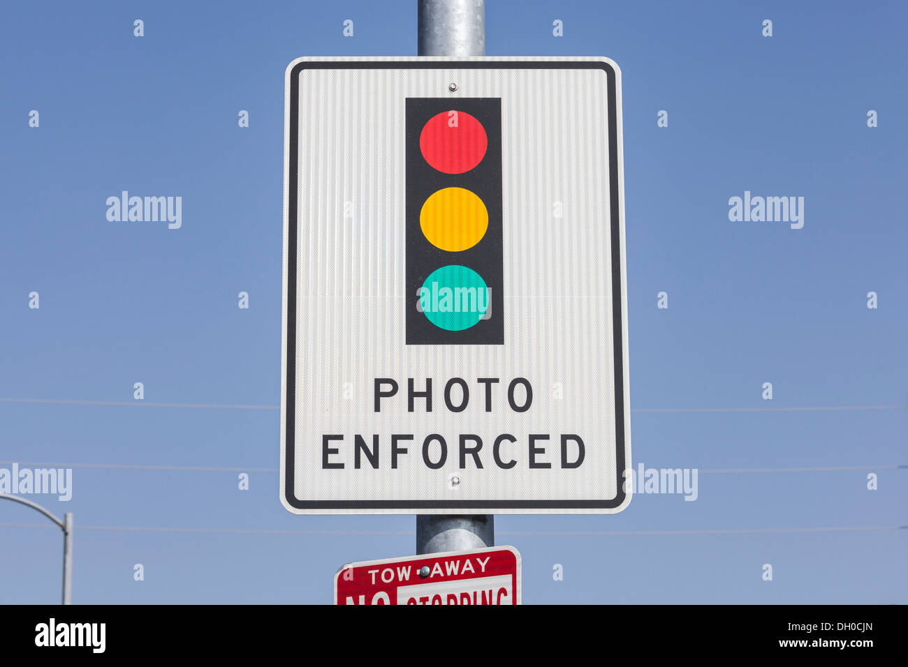 Photo enforced traffic light warning sign. Stock Photo