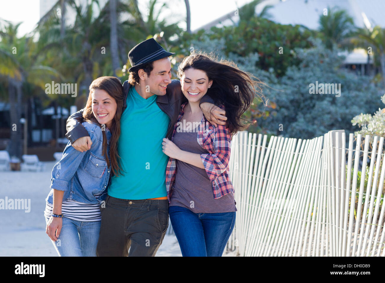 Friends walking on beach Stock Photo