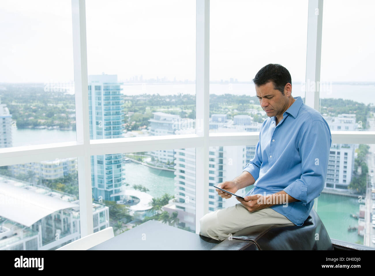 Hispanic businessman using digital tablet in office Stock Photo