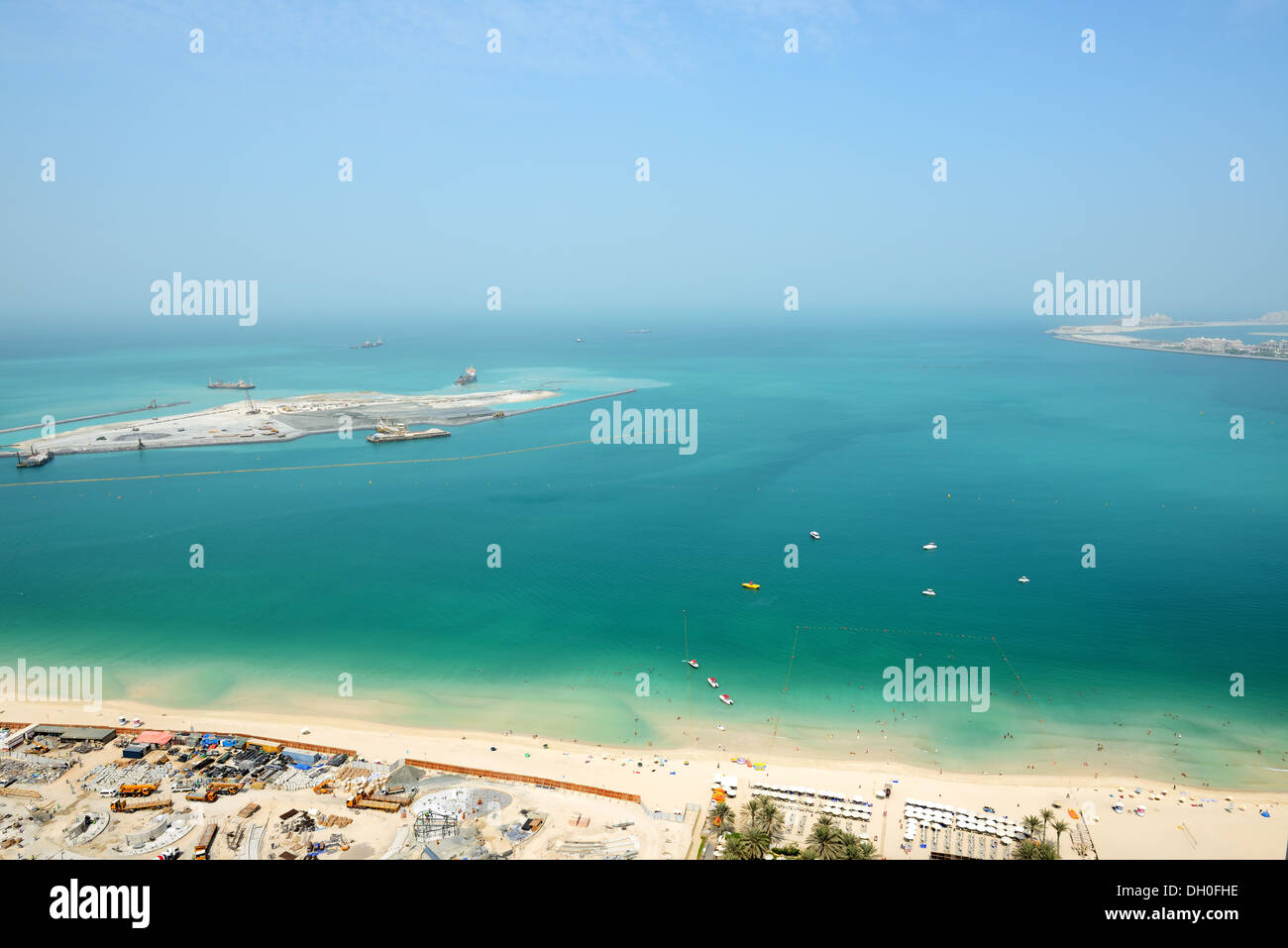 The view on construction of the new hotel and construction of 210-metre Dubai Eye and part of Palm Jumeirah, Dubai, UAE Stock Photo