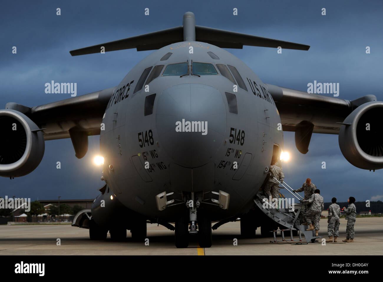 C-17 Globemaster III during an unloading mission at Langley Air Force Base, Va., Oct. 23, 2013. The Soldiers partnered with Airm Stock Photo