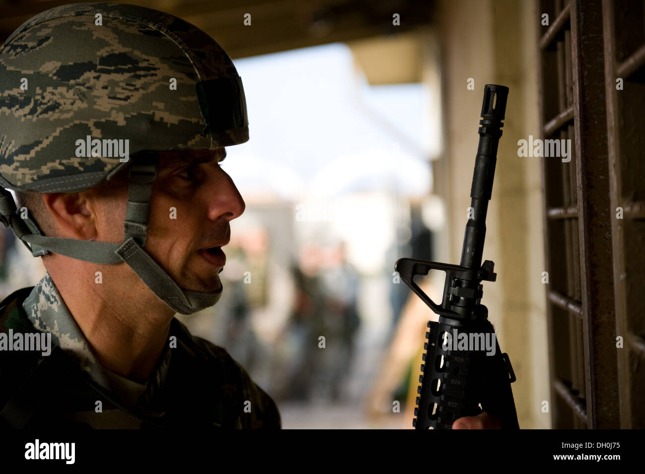 Lt. Col. Frank Hughes, 8th Civil Engineer Squadron commander, receives his weapon during the 8th CES readiness training day at Kunsan Air Base, Republic of Korea, Oct. 24, 2103. Airmen from the 8th CES trained with the 8th Security Forces Squadron on how Stock Photo